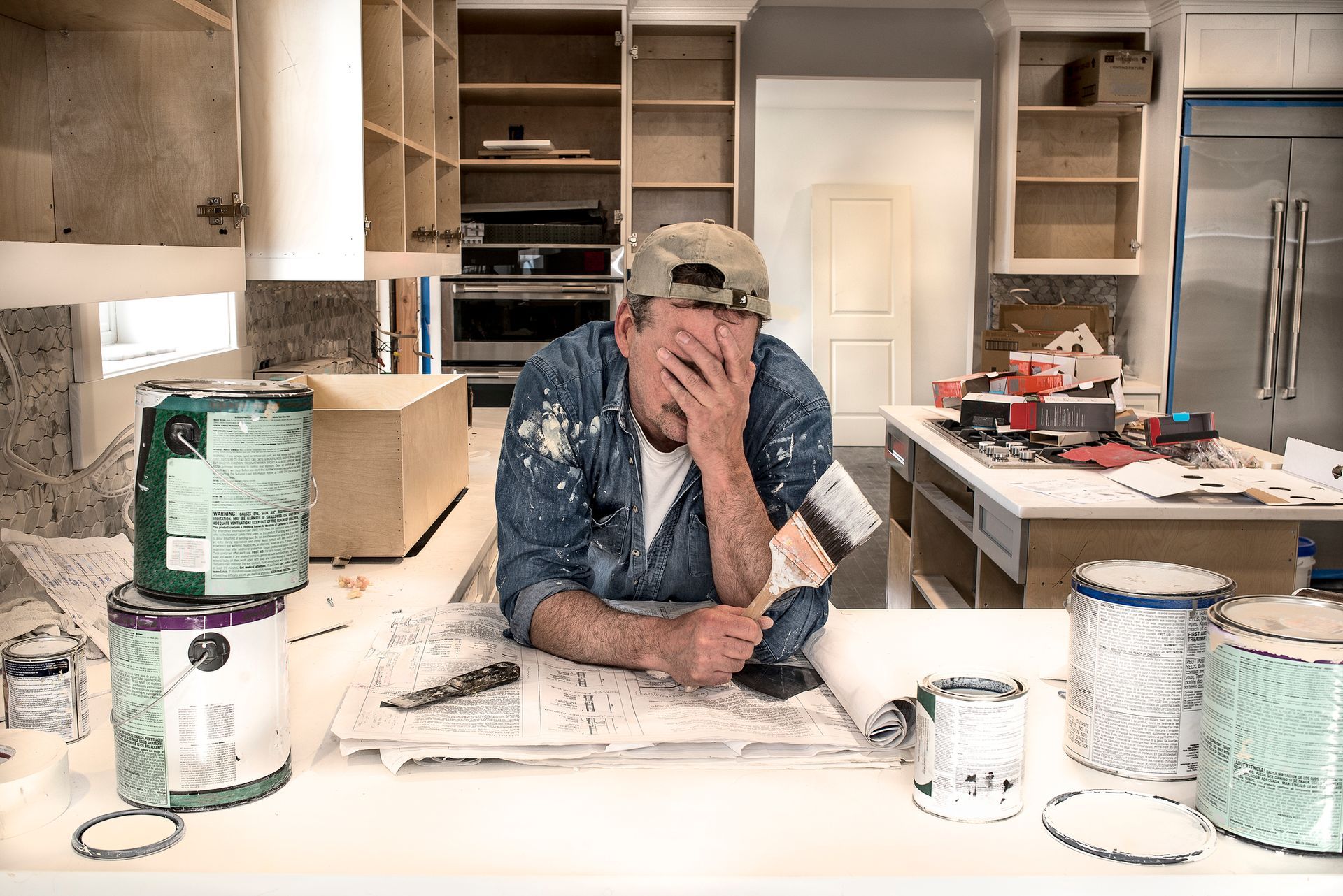 frustrated man amidst a kitchen remodel