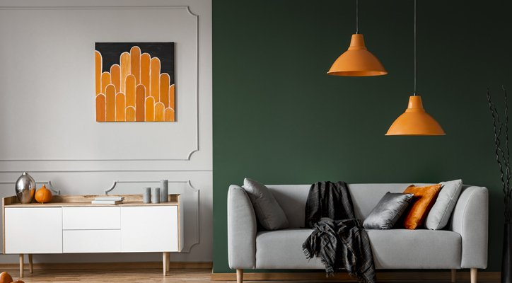 living room with a dark green accent wall to create contrast