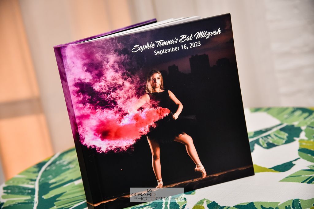 A book with a picture of a woman on the cover is sitting on a table.