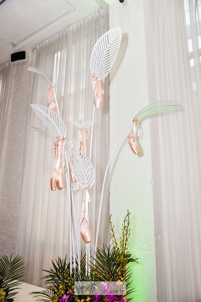 A bunch of balloons hanging from the ceiling in a room.