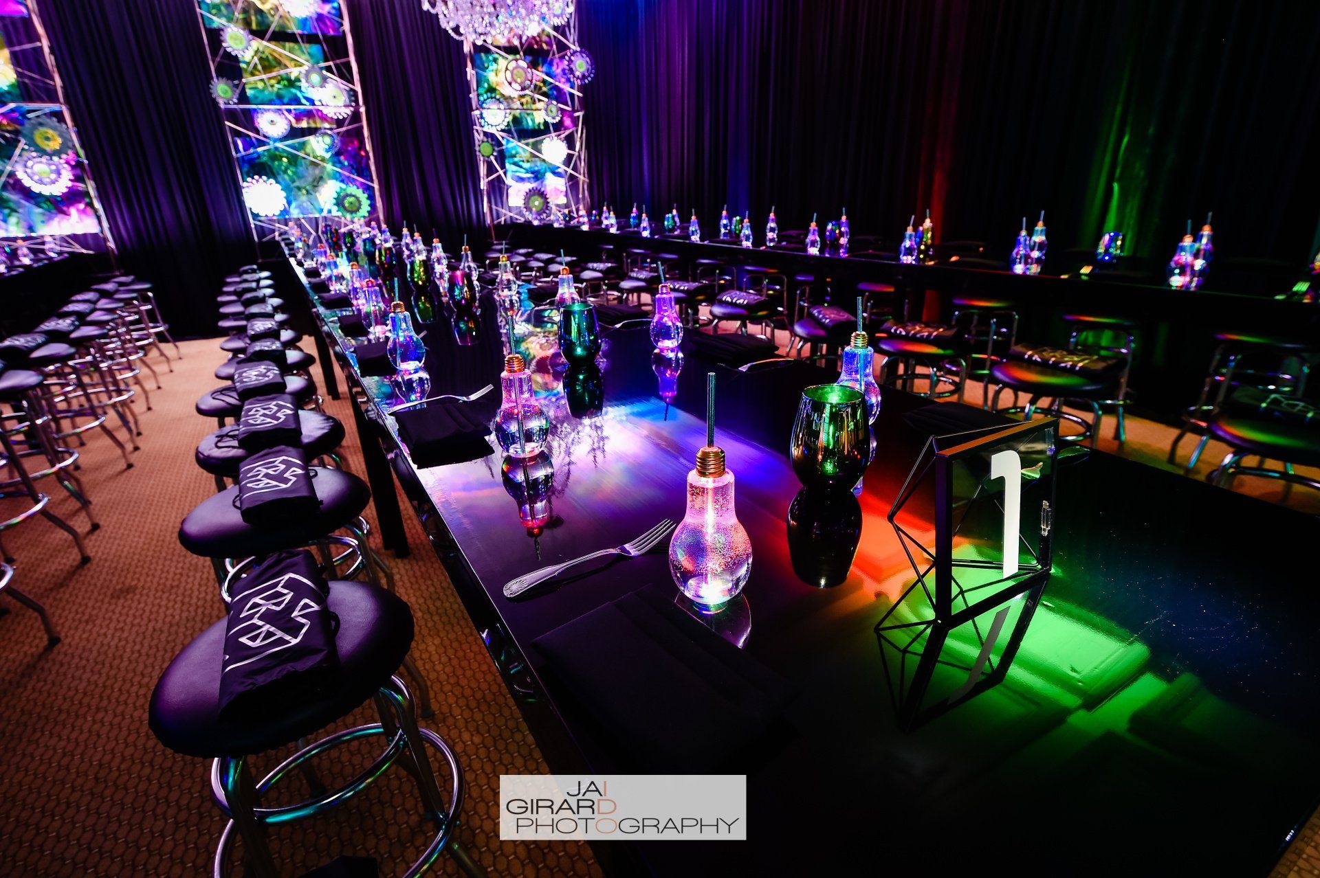 A long table with a lot of bottles on it