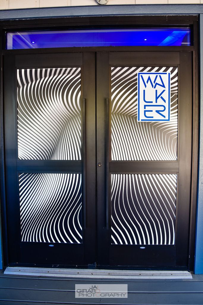 A black door with a blue light on top of it