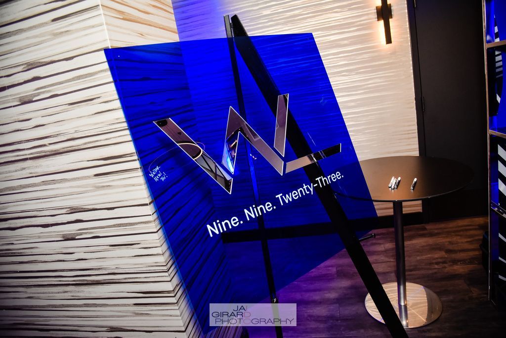 A blue sign that says nine nine theatre on it