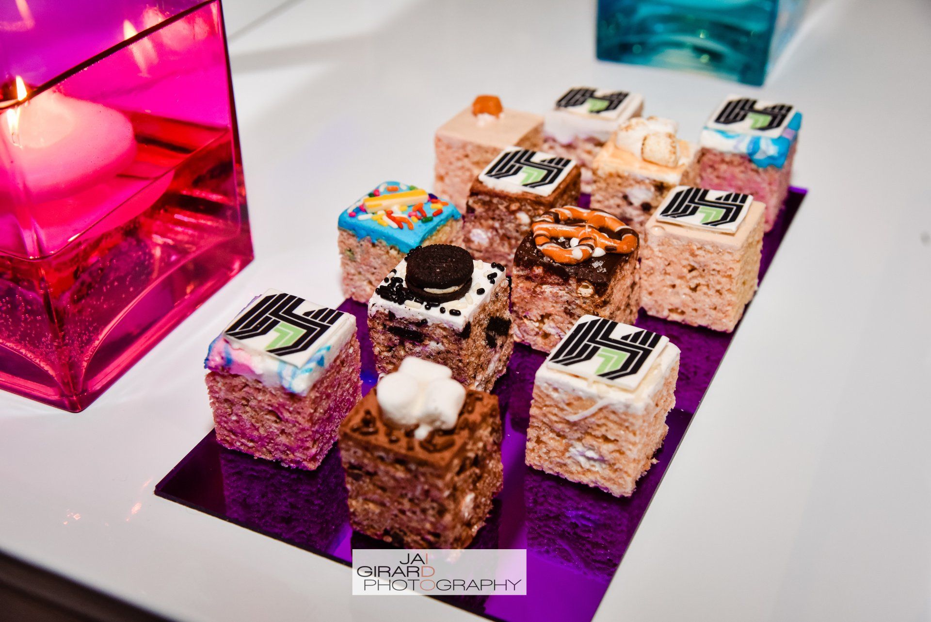 A tray of rice krispie treats with the letter h on them