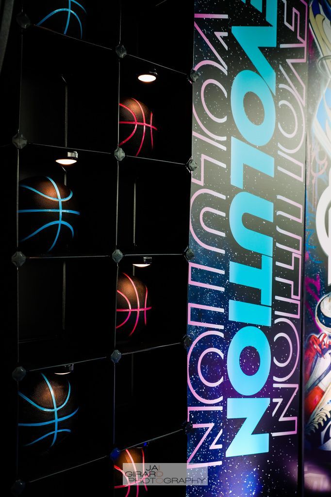 A basketball hoop with a sign that says evolution on it