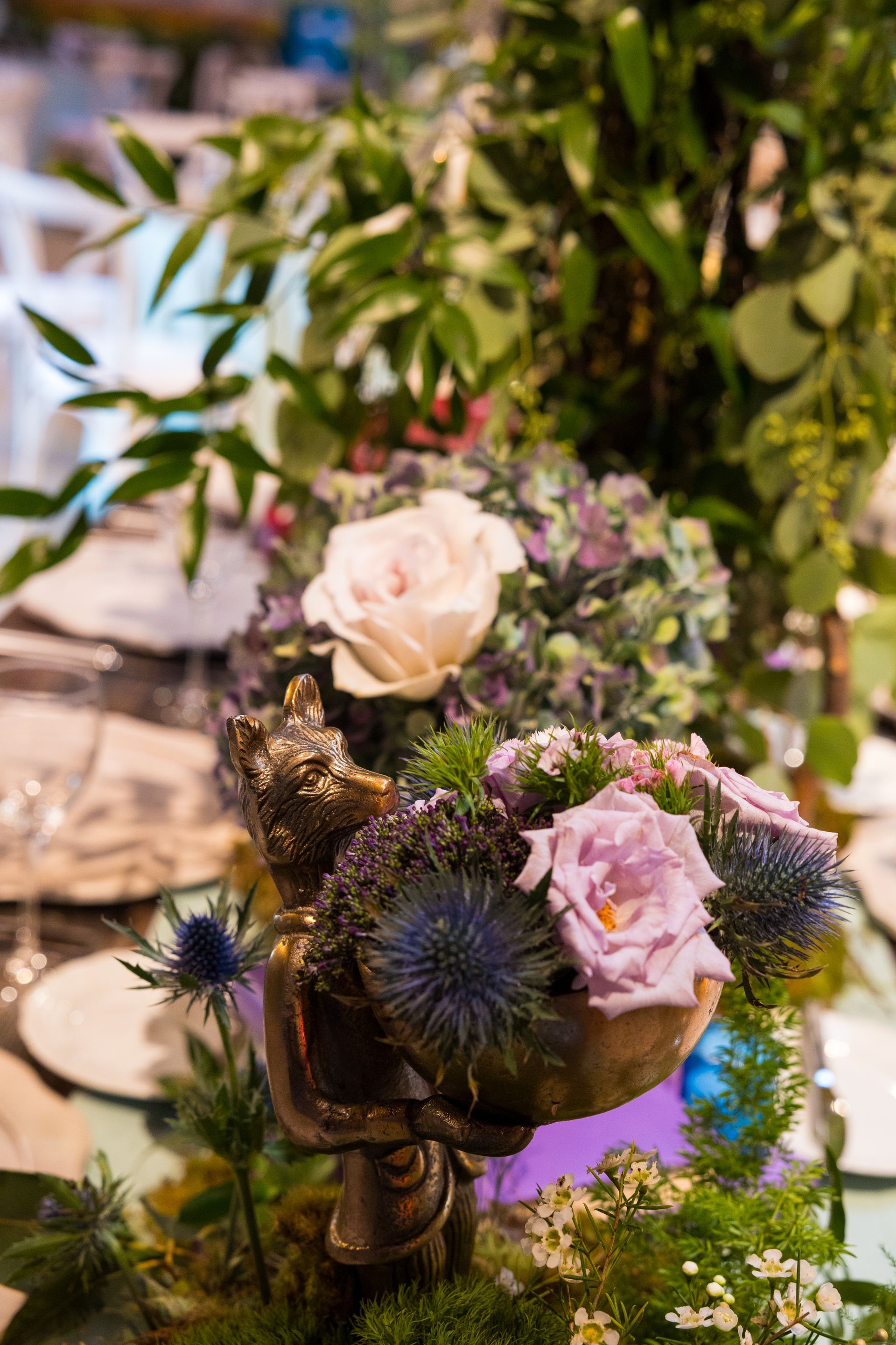 A vase filled with flowers is on a table.