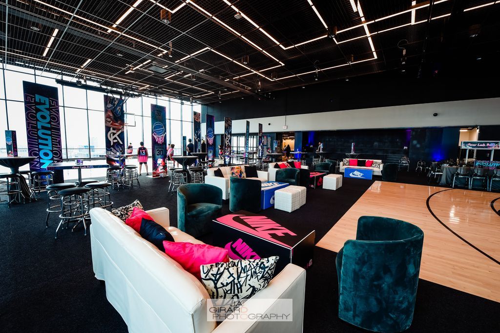 A large room with a couch and chairs in it