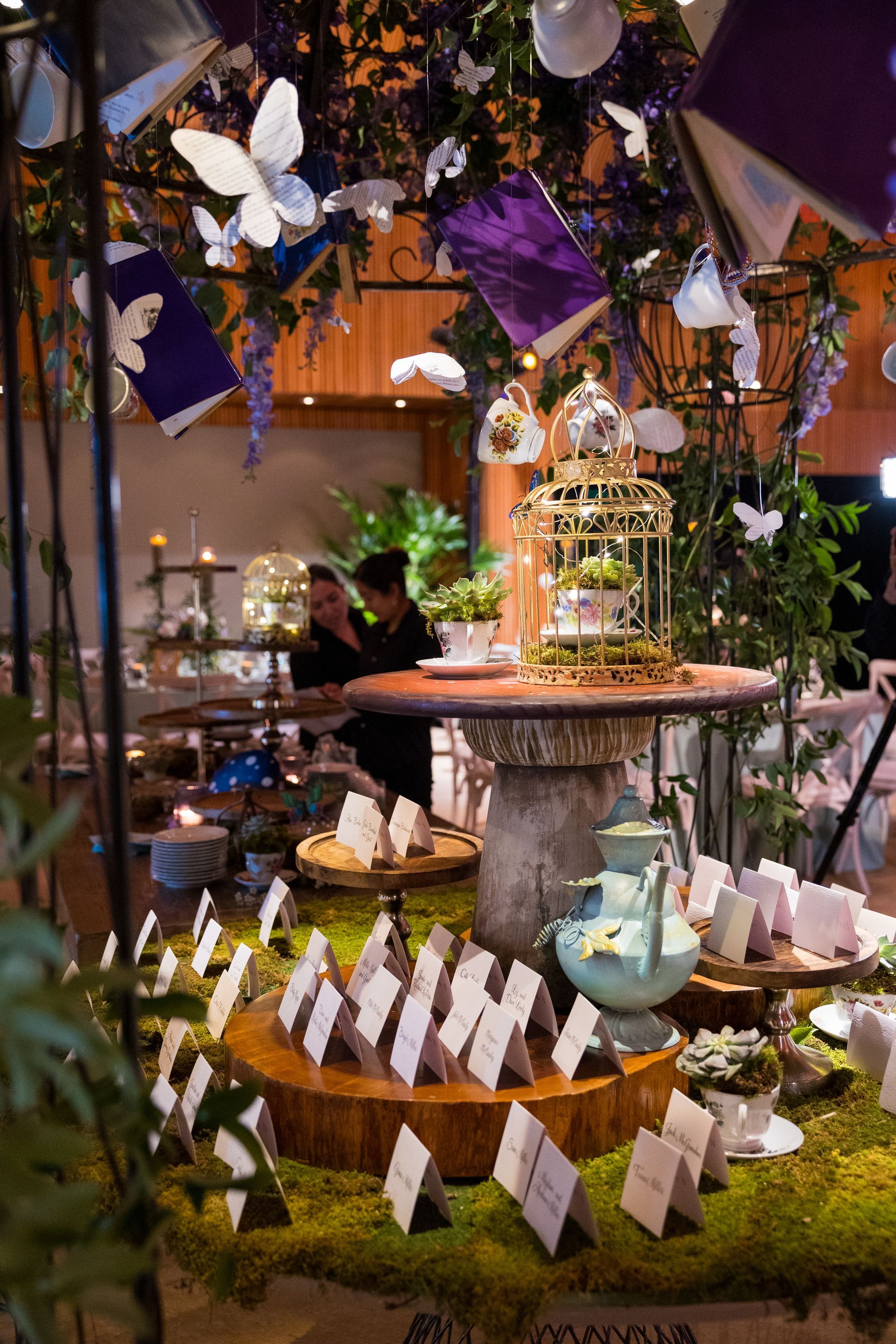 A table with a lot of place cards on it in a room.