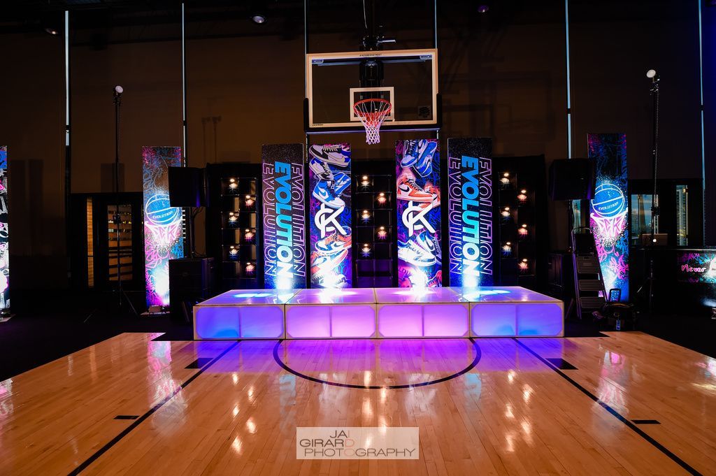 A basketball court with a stage in the middle of it