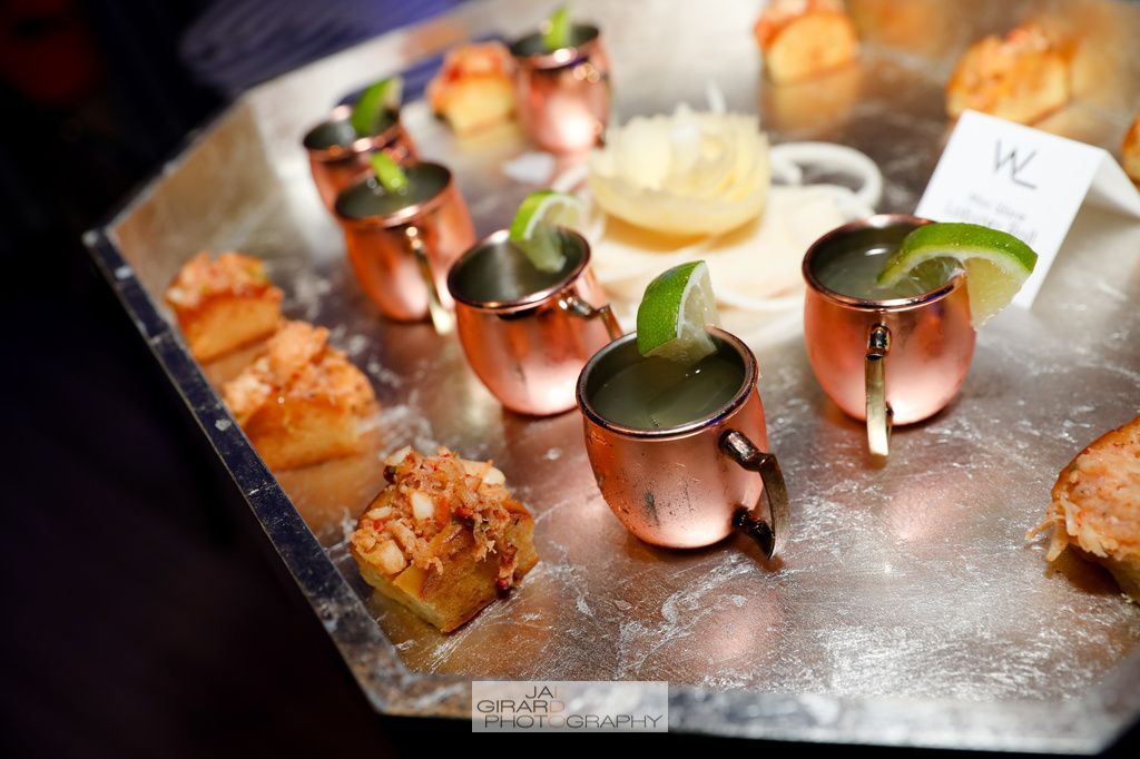 A close up of a tray of food and drinks on a table.