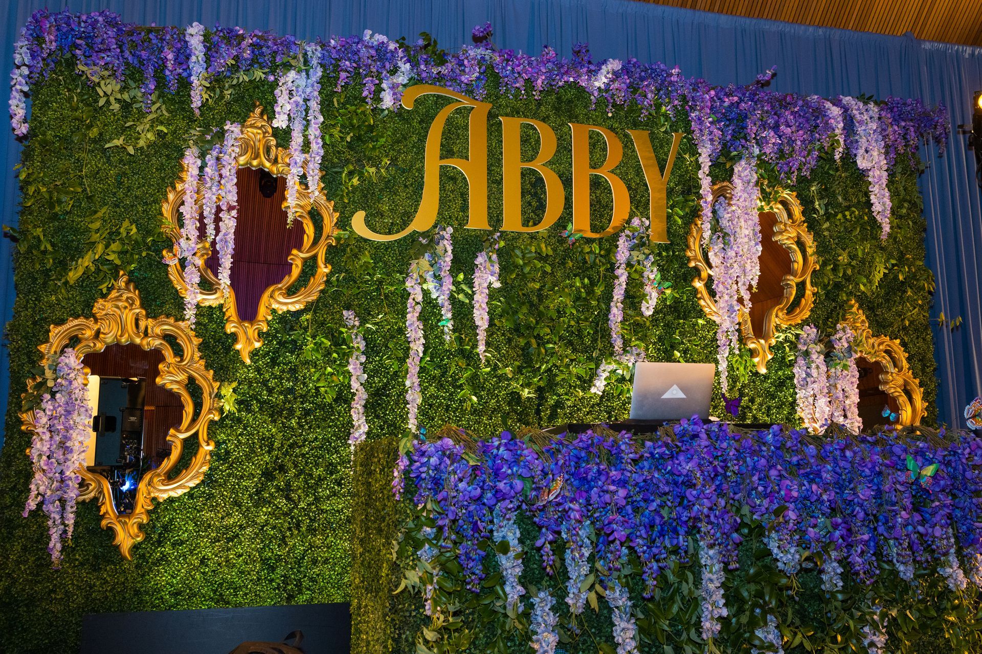 A green wall with the name abby on it