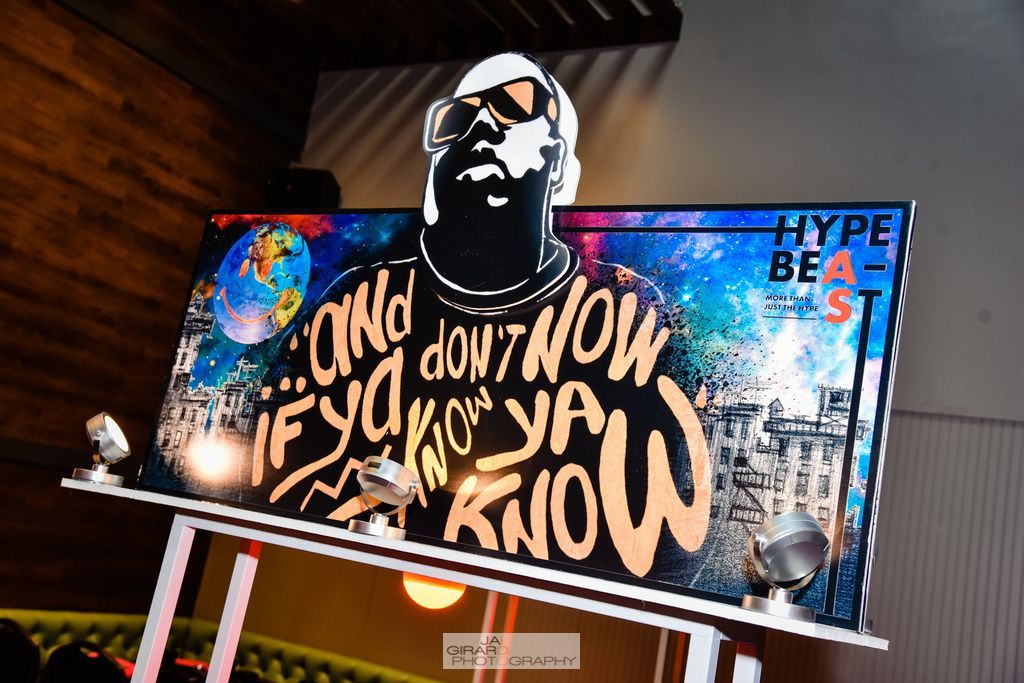 A billboard with a picture of a man and the words 