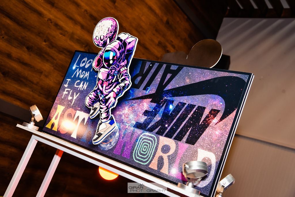 A painting of a basketball player with the word nike on it