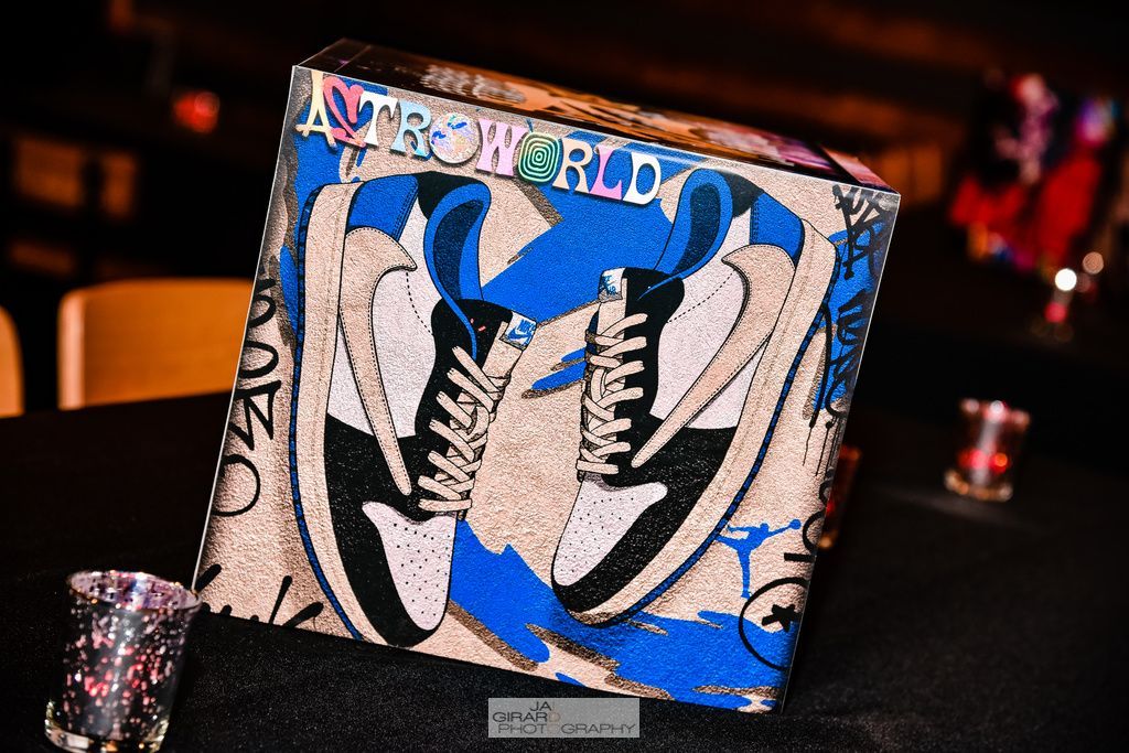 A box with a picture of a pair of shoes on it is sitting on a table.