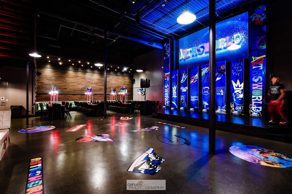 A large room with a lot of lights on the walls and floor.