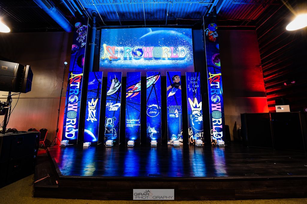 A stage with a large screen on top of it