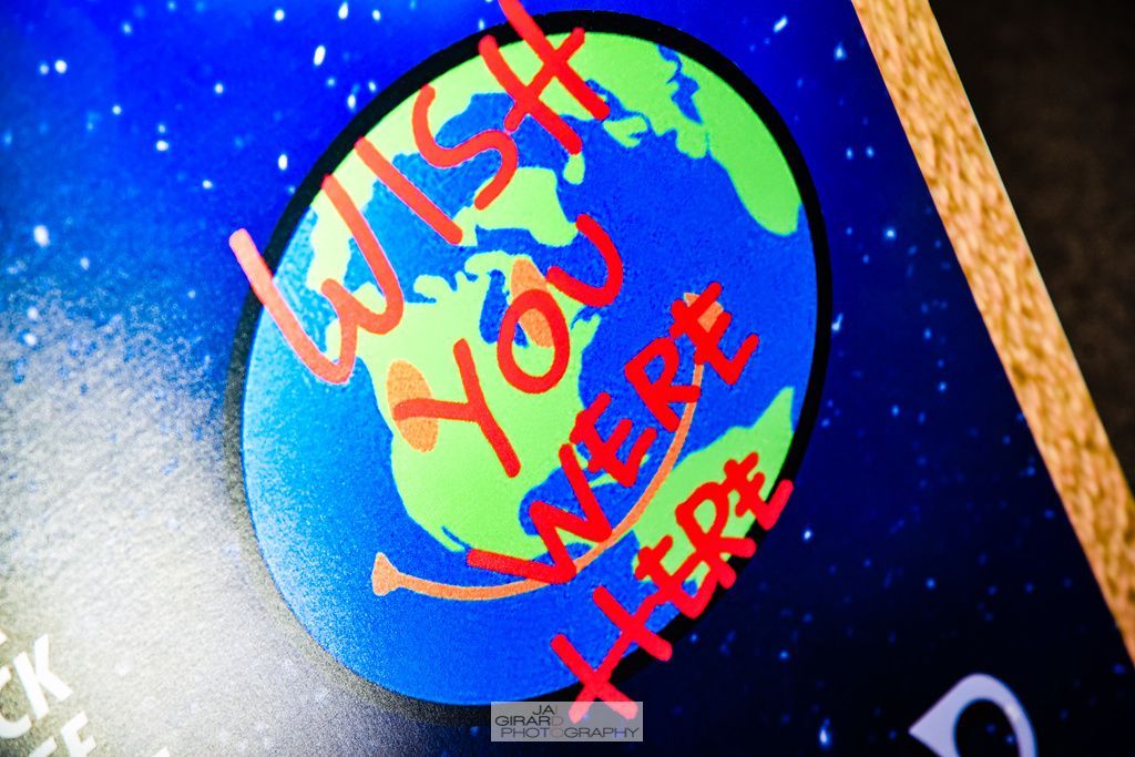 A poster that says wish you were here on it