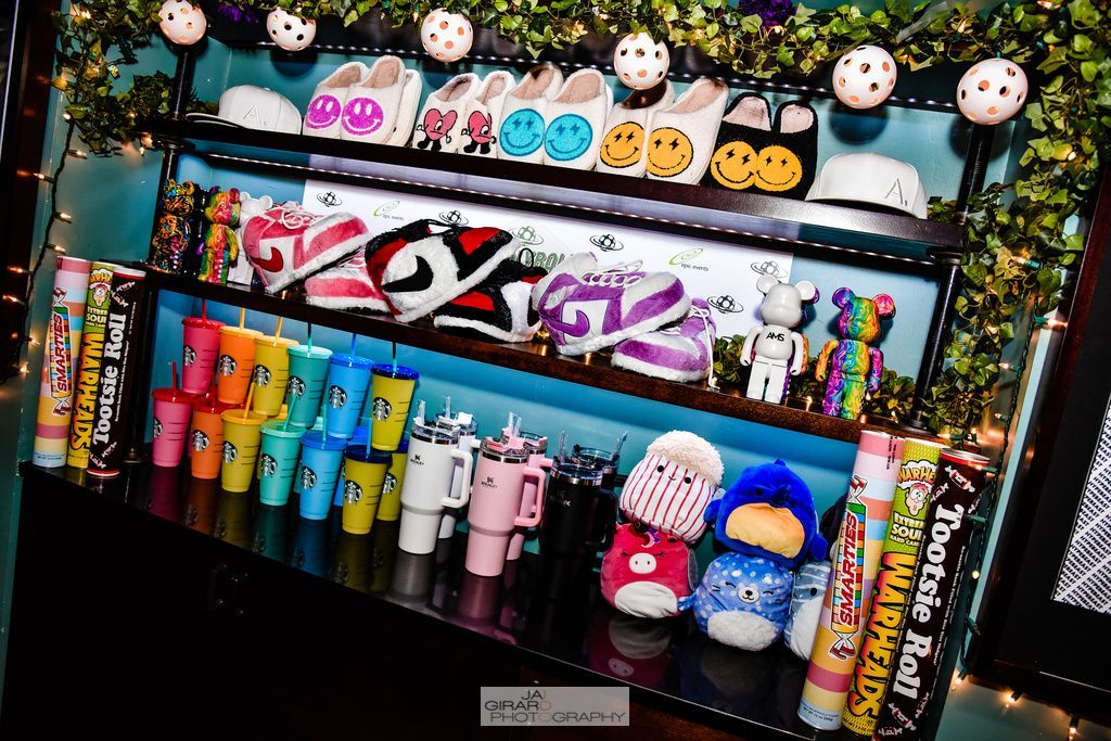 A shelf filled with lots of stuffed animals and toys
