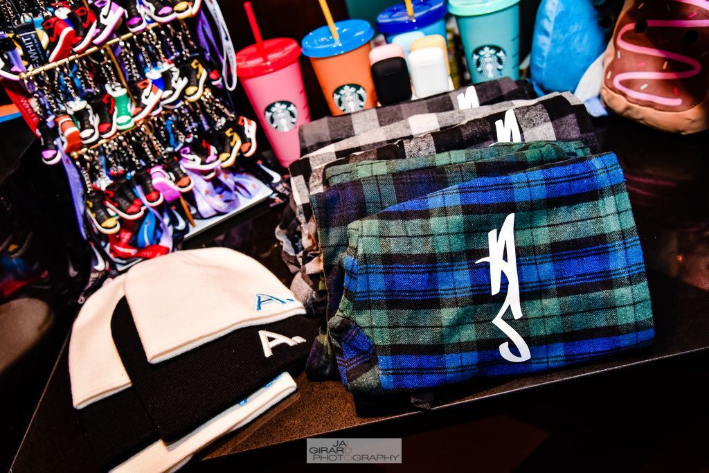 A bunch of starbucks cups are sitting on a table.