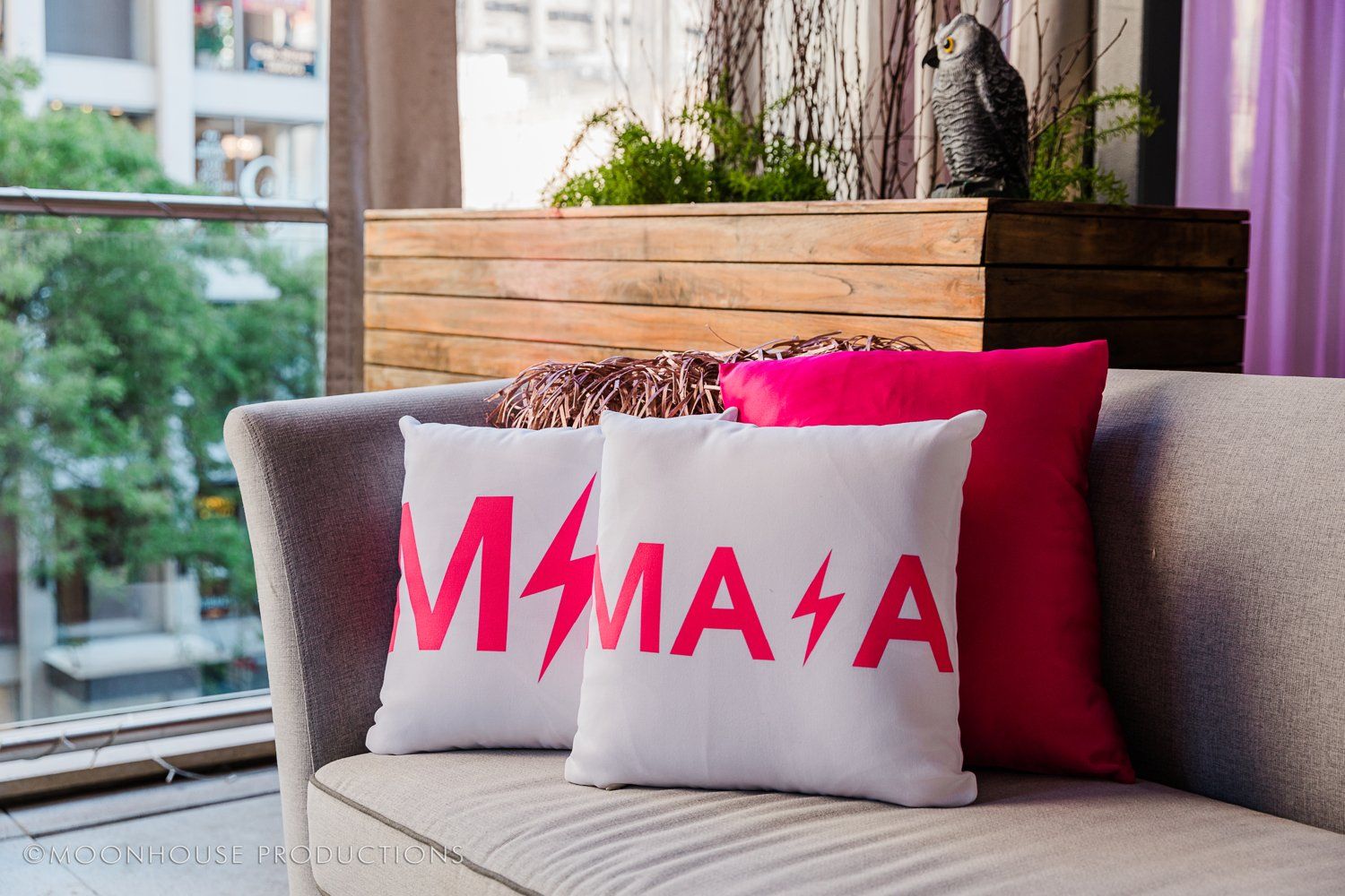 A couch with a pillow that says mama on it