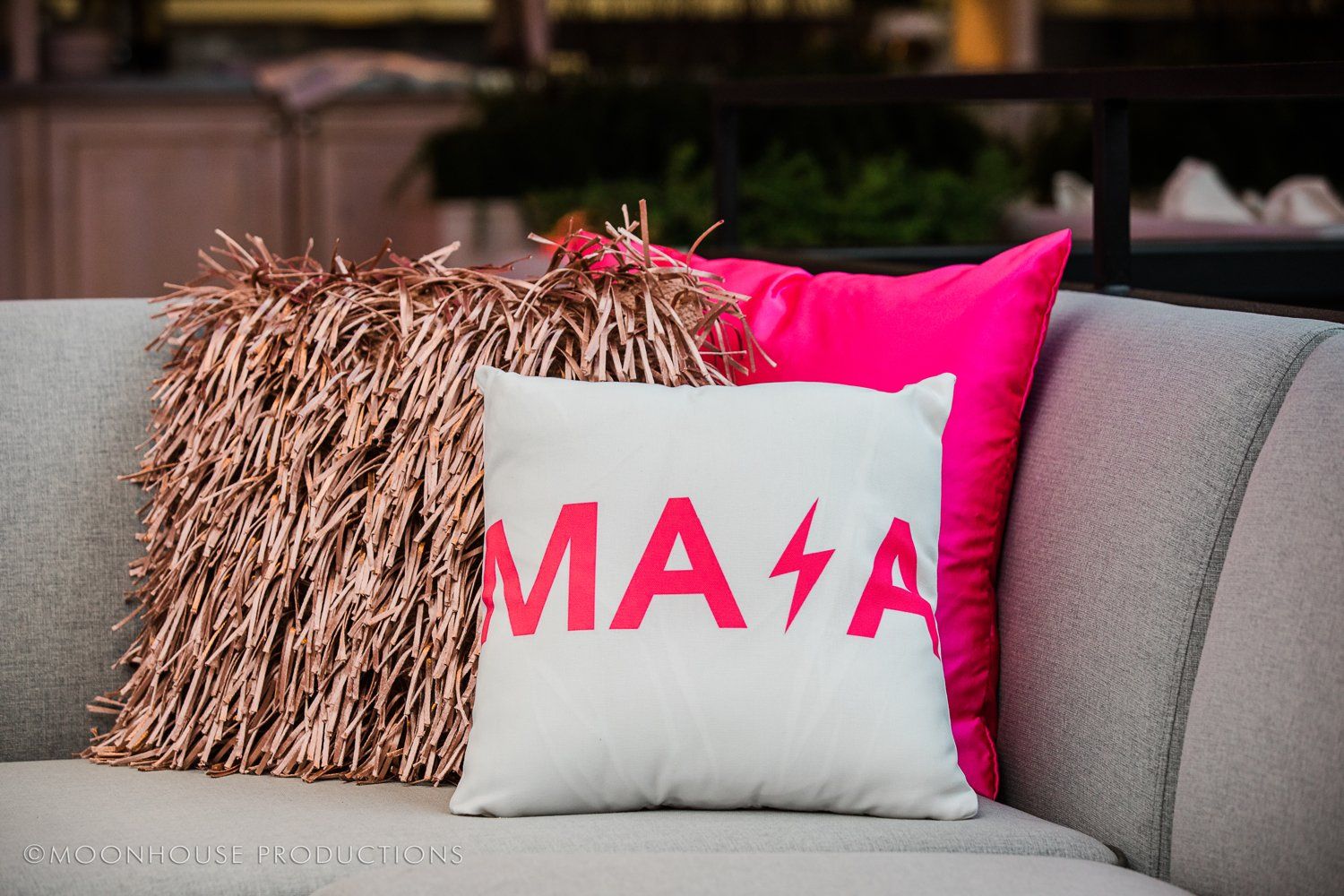 A couch with a pillow that says masa on it