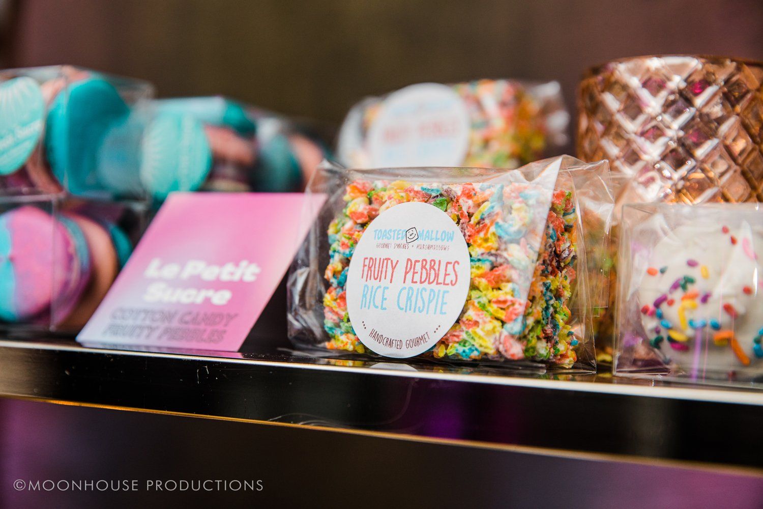 A display of candy with a sticker that says fairy petals on it.