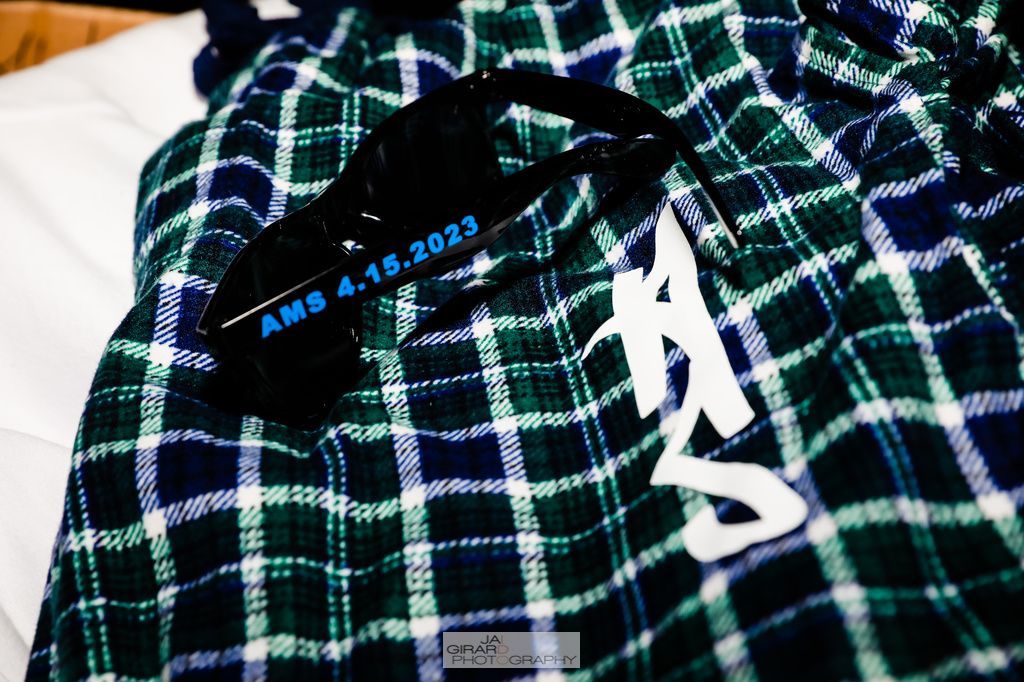 A plaid blanket with the name amb written on it