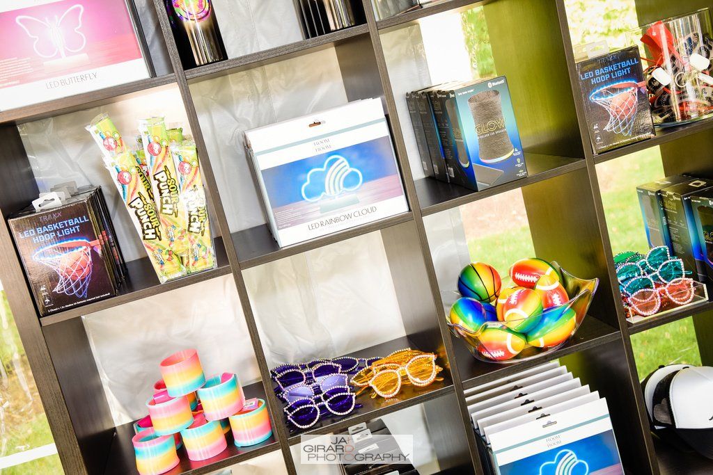 A shelf filled with a variety of toys and decorations.