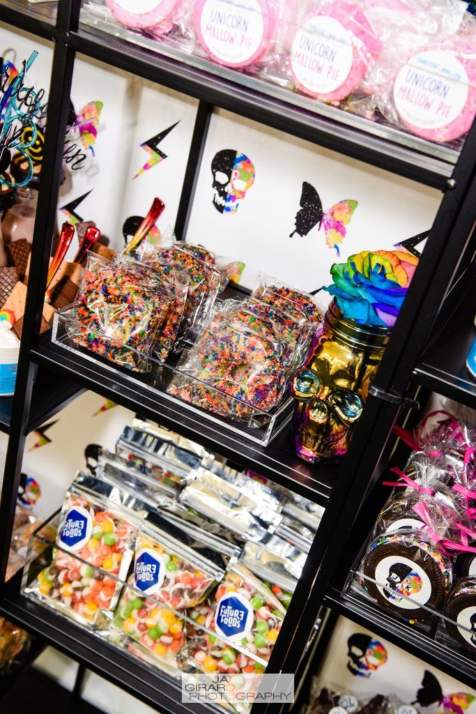 A shelf filled with lots of different types of candy.