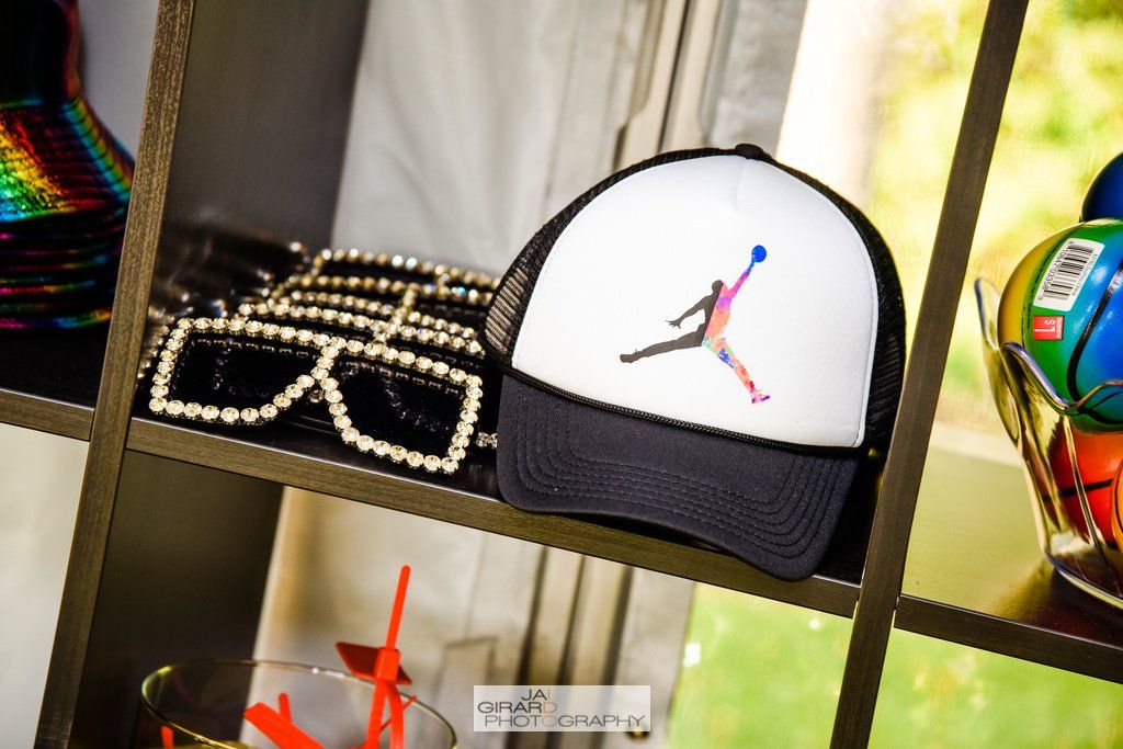 A shelf with a hat and sunglasses on it