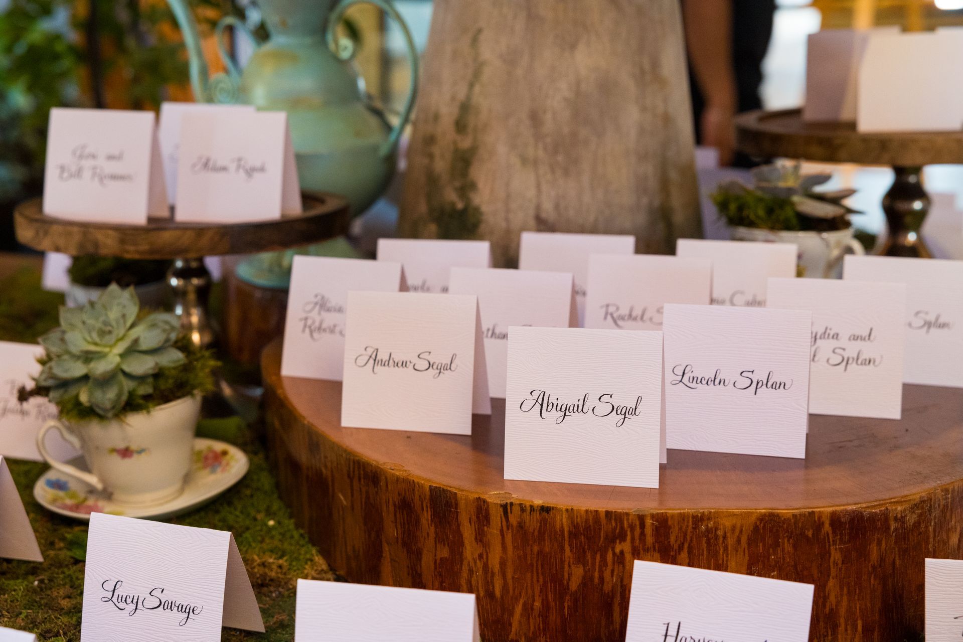 A table with a lot of place cards on it.