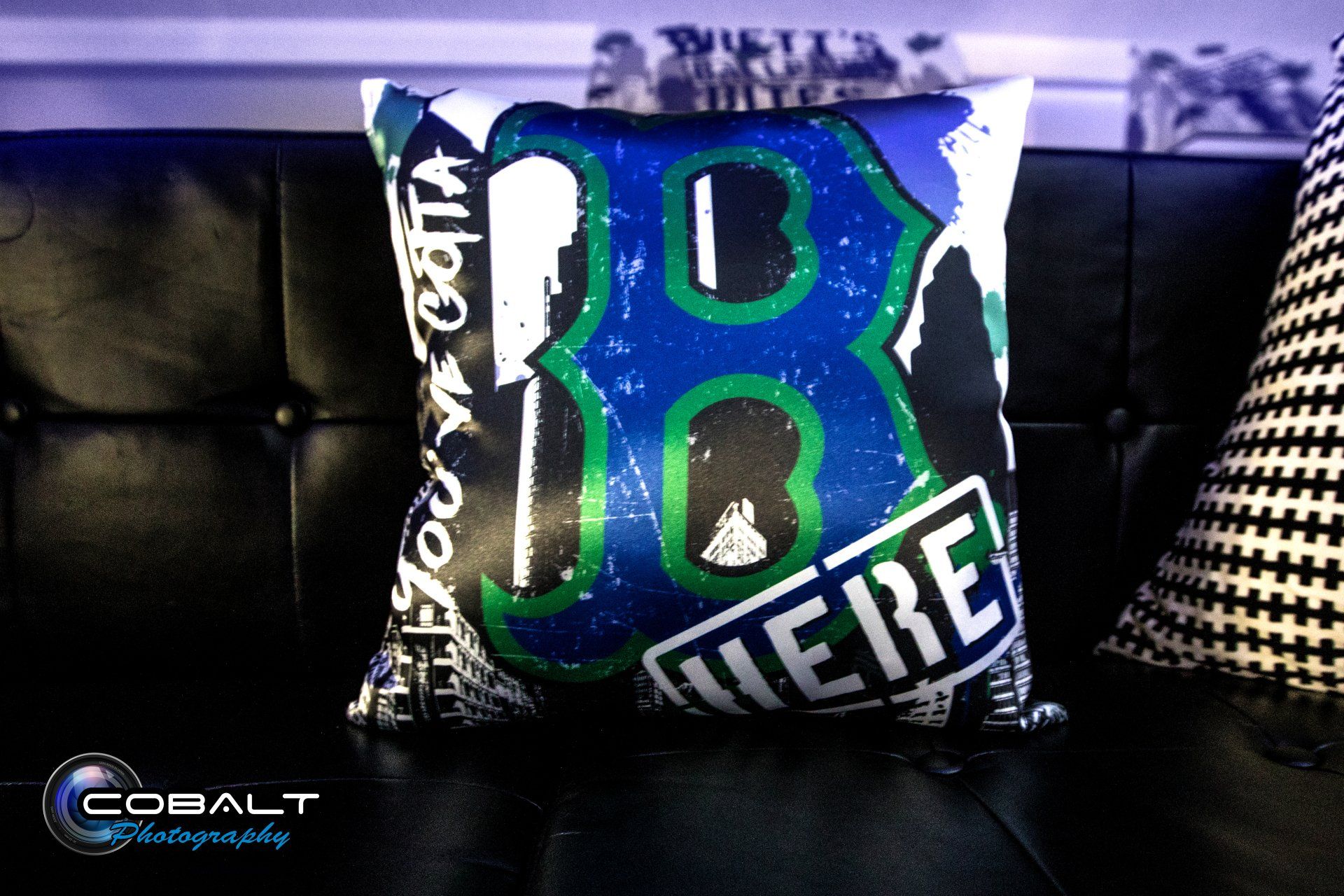 A pillow that has the number 18 on it