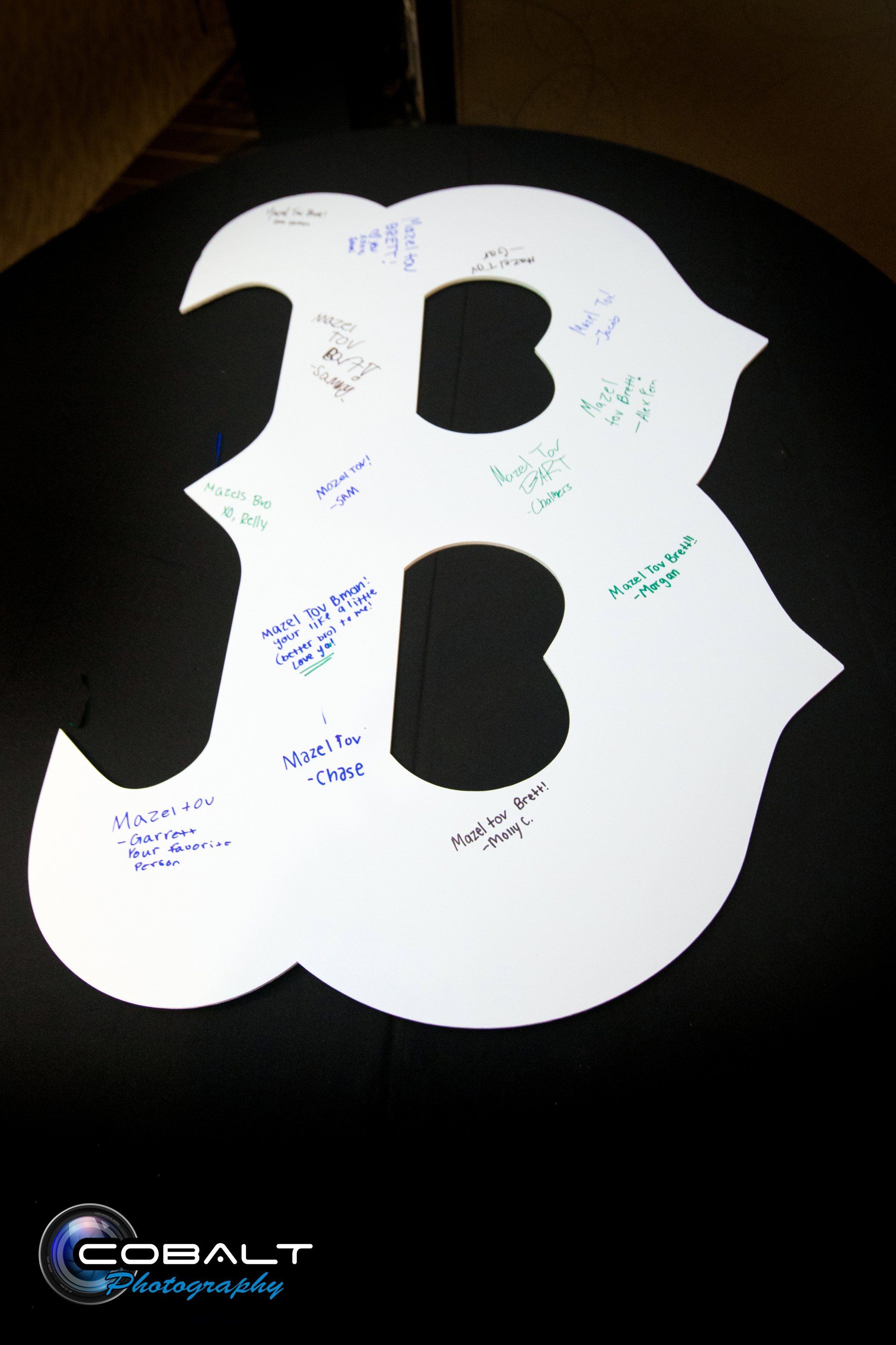 The letter b is cut out of a piece of paper