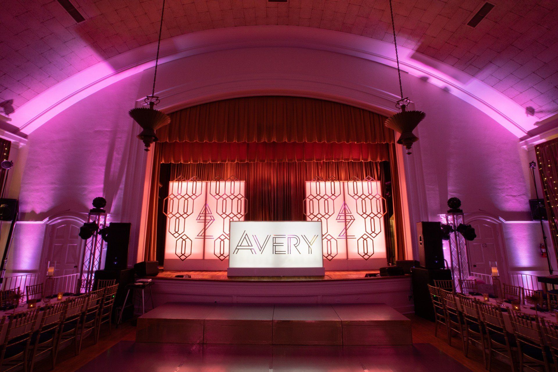 A stage with a sign that says avery on it
