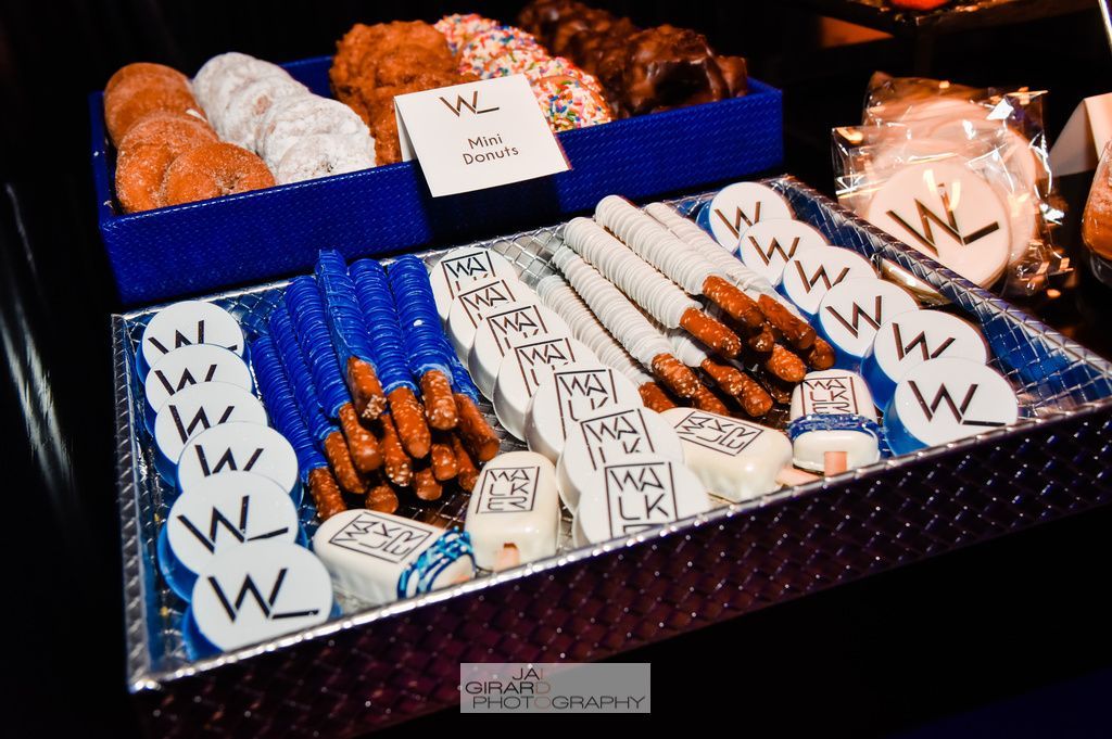 A tray of donuts and pretzels with the letter w on them