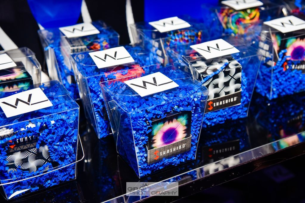 A bunch of blue boxes sitting on top of each other on a table.