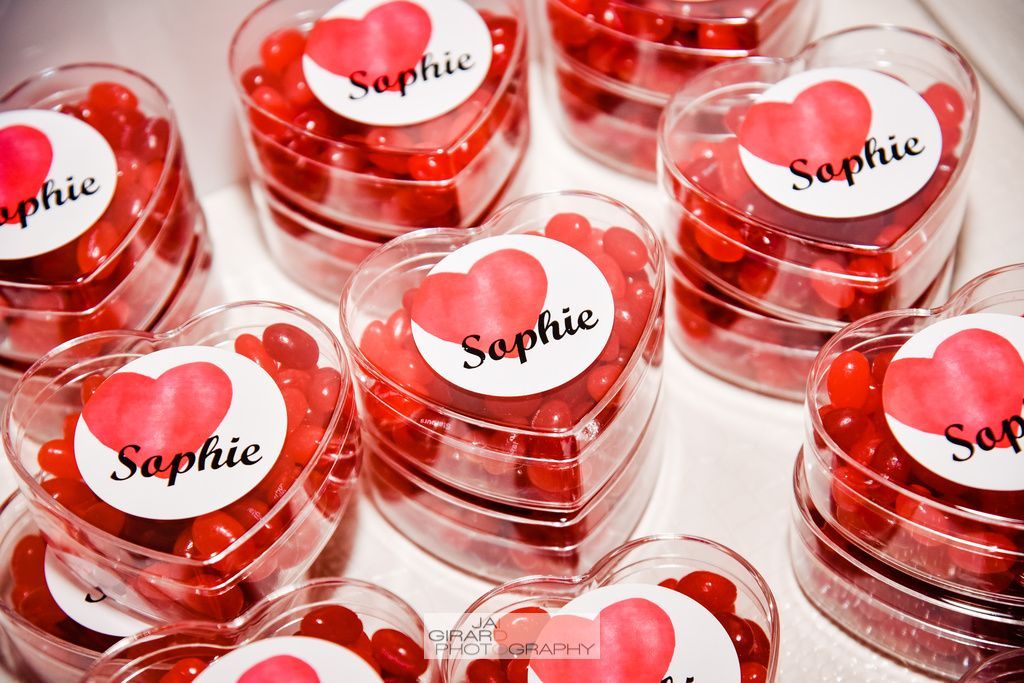 A bunch of heart shaped containers with the name sophie on them