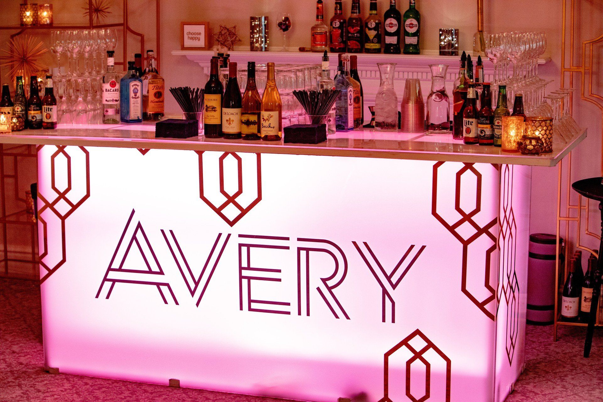 A pink bar with the name avery on it