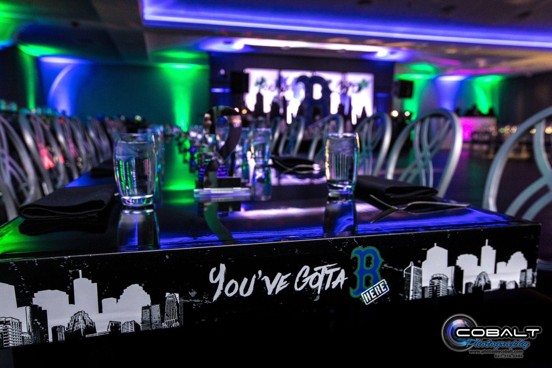 A table set for a party with a sign that says you 've got a