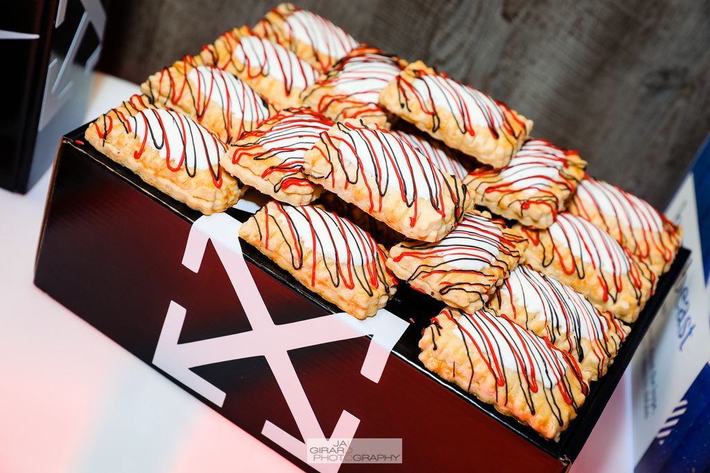 A box of pastries with a white x on it