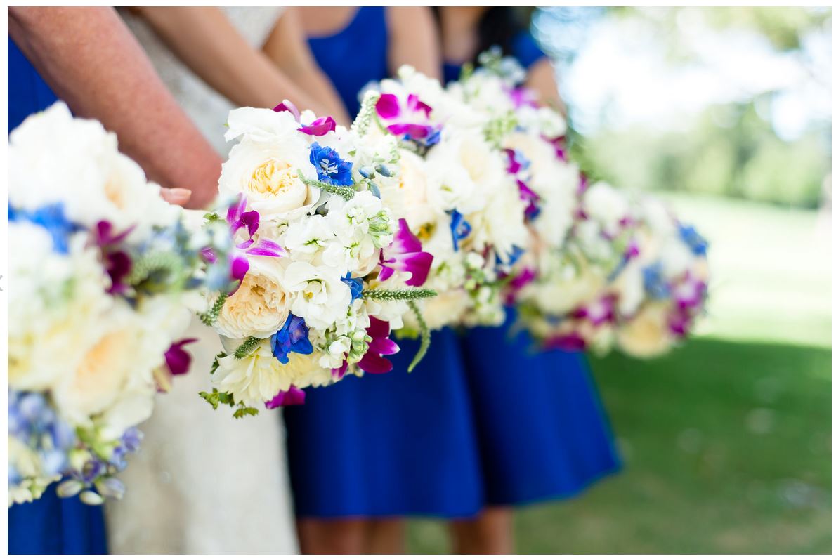 A bride and her bridesmaids are holding bouquets of flowers