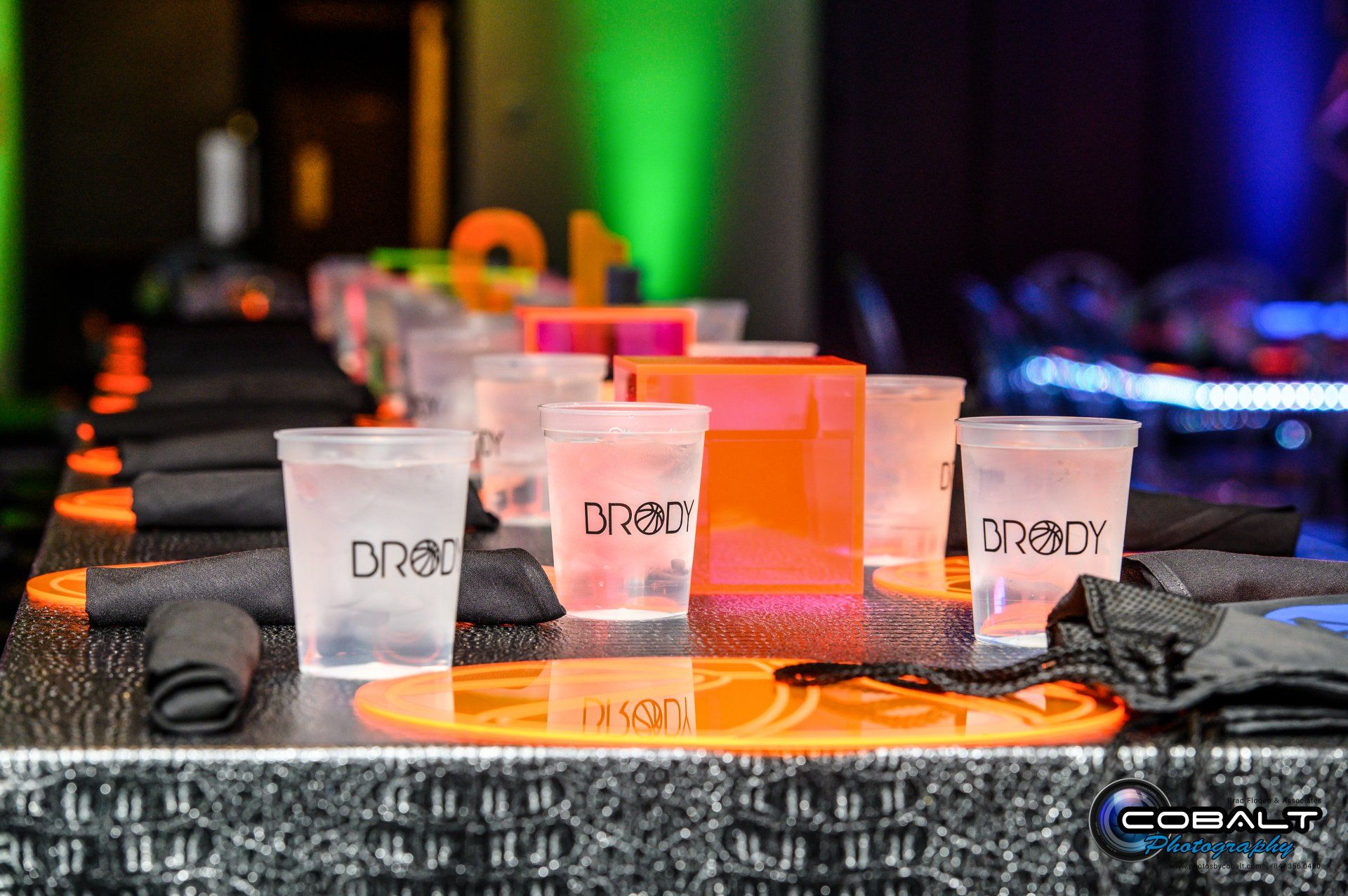 A row of plastic cups sitting on top of a table.