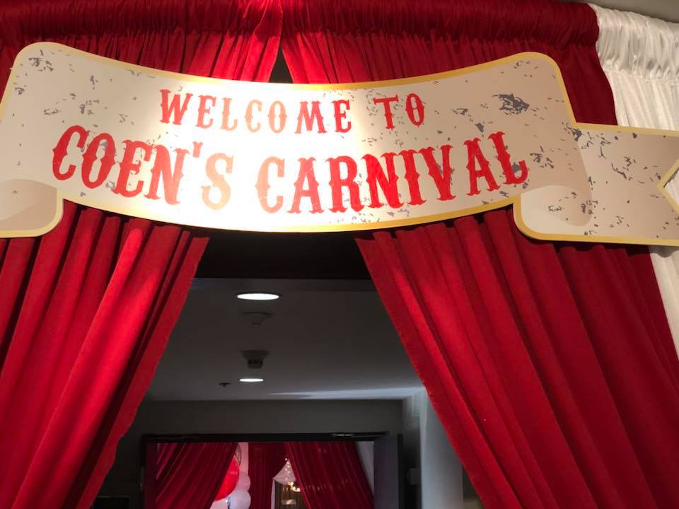 A sign welcomes people to coen 's carnival