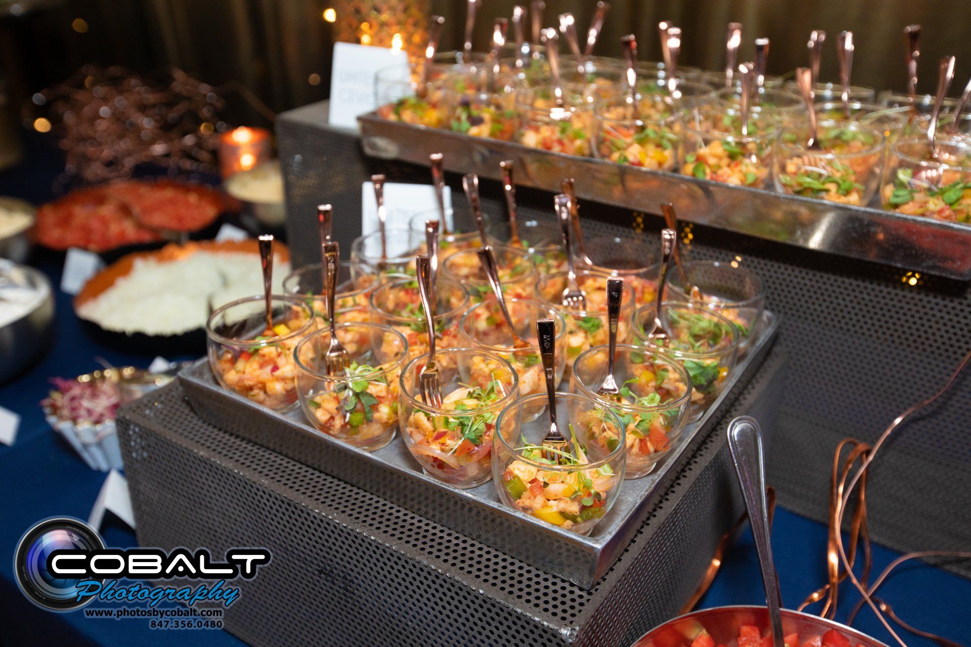 A buffet table with a lot of food and a sign that says cobalt