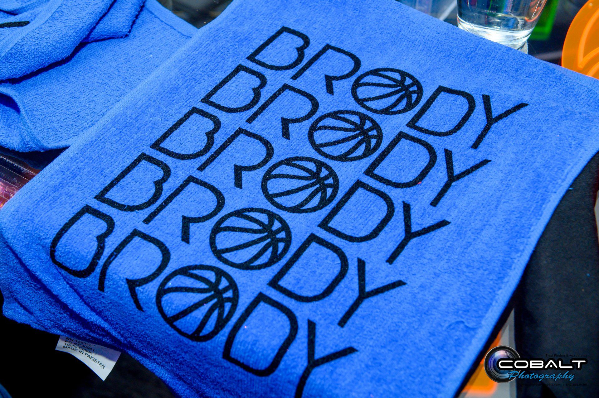 A blue towel that says brody on it