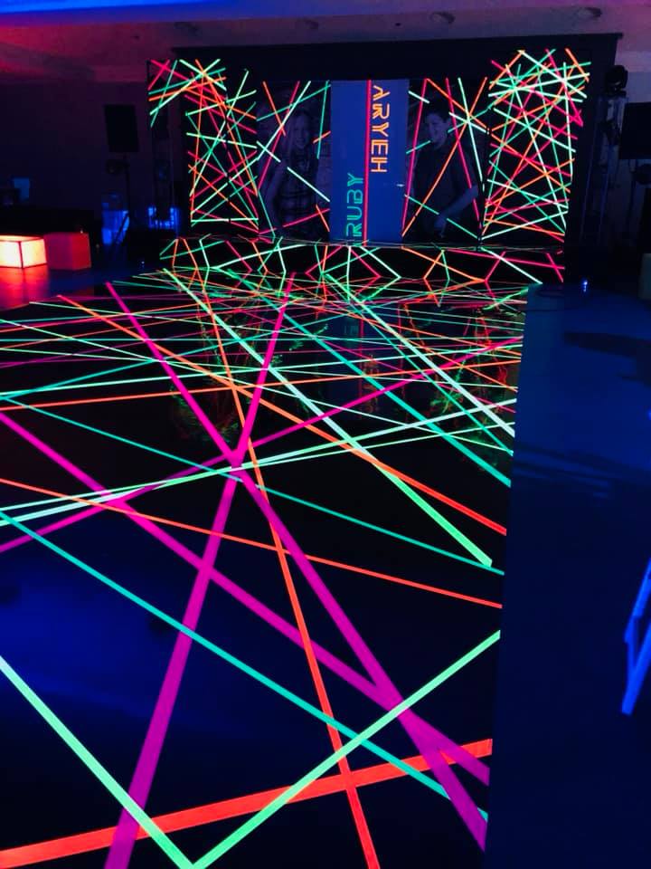 A dance floor with glow in the dark tape on it