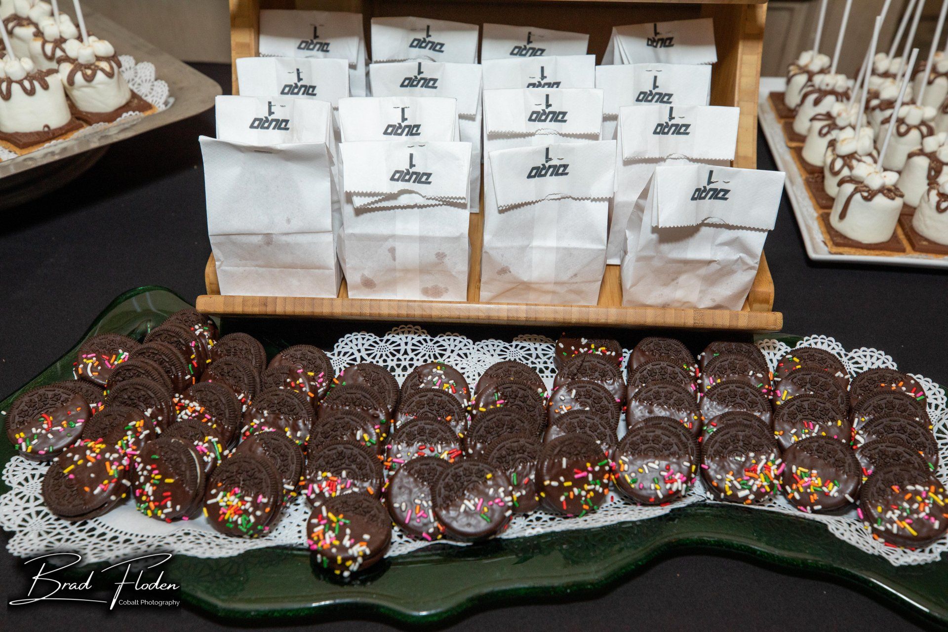 A tray of chocolate cookies with sprinkles on them