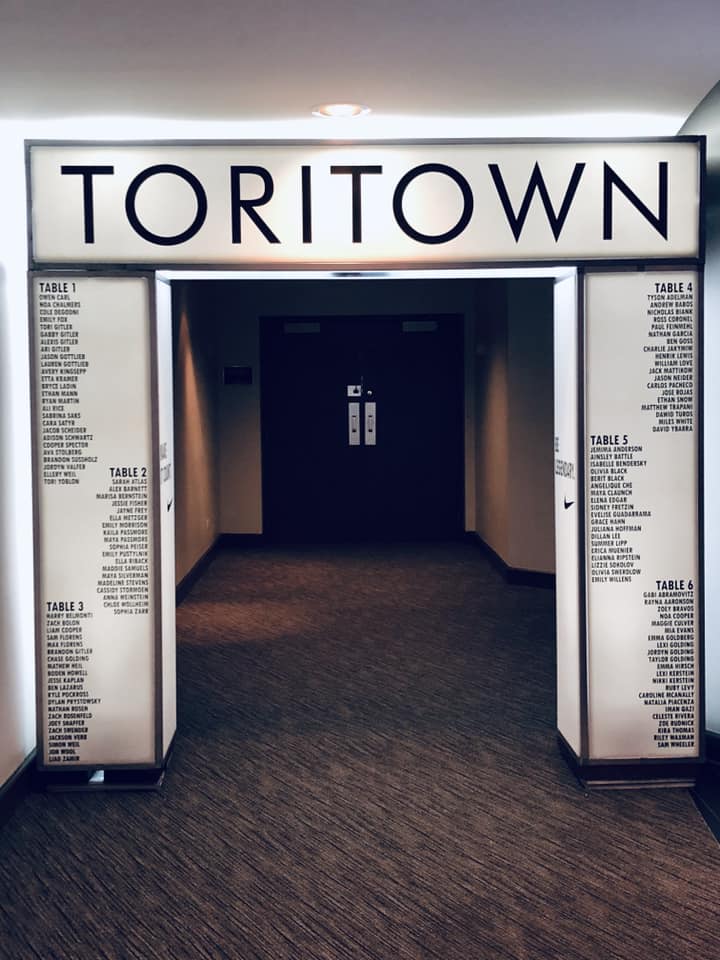 A hallway with a sign that says toritown