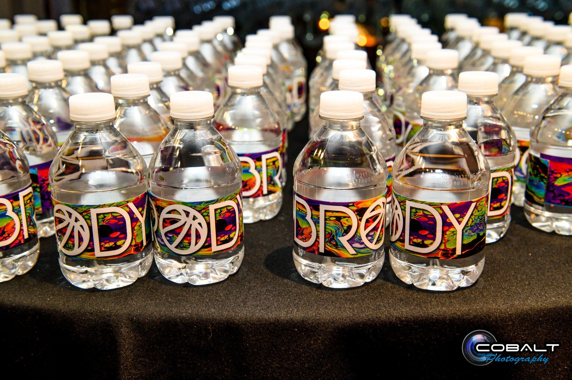 A bunch of water bottles with the word body on them