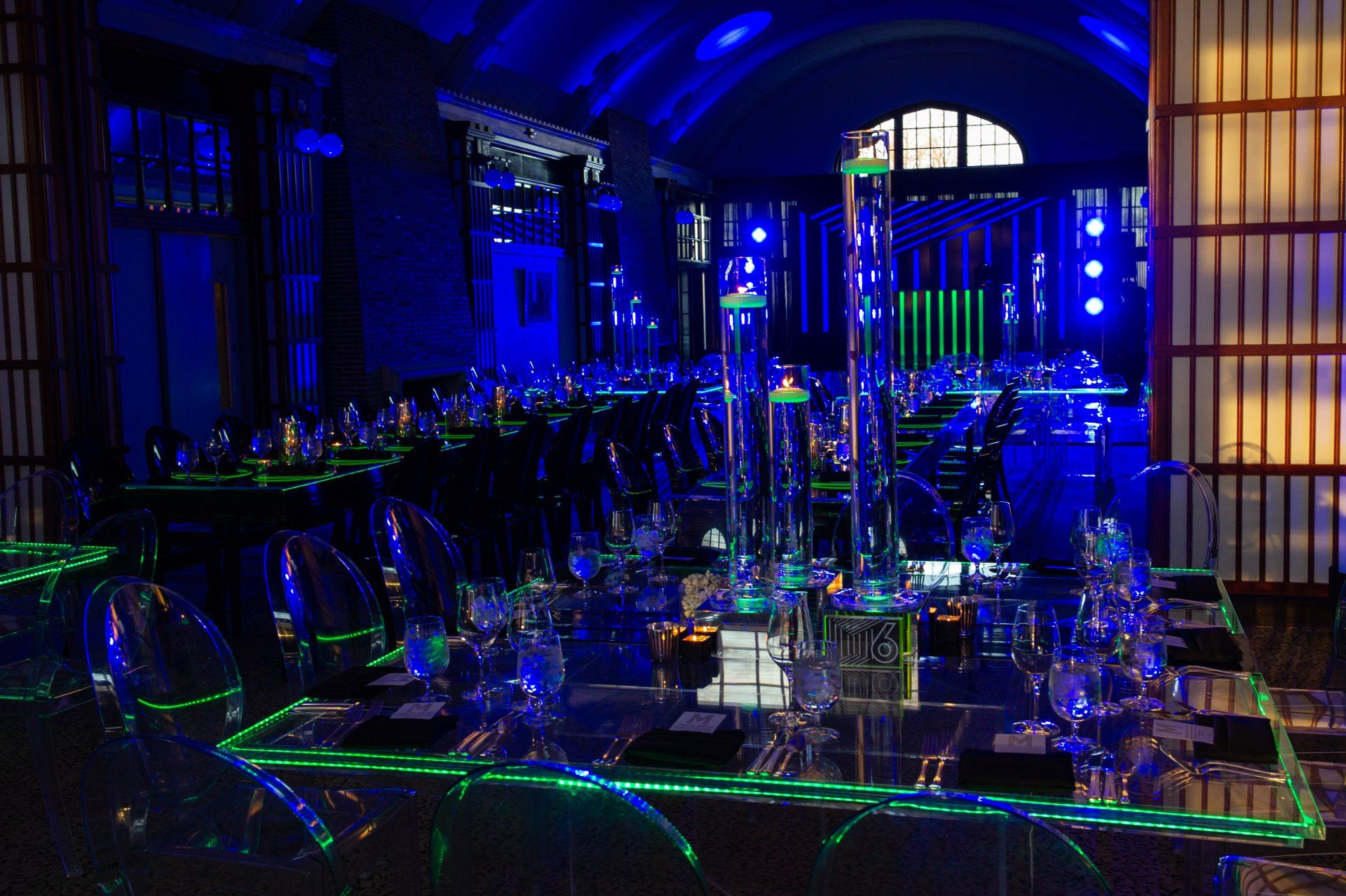 A dark room with a lot of lights on the tables